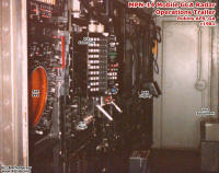 Inside the MPN-14 Equipment Trailer. ASR display nearest the door with IFF control box next to it. PAR display near the arm protruding by door. (circa 1979-82)