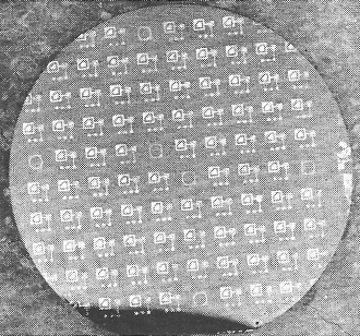 Large numbers of integrated circuits are normally deposited or grown simultaneously through "masks" on thin silicon wafers