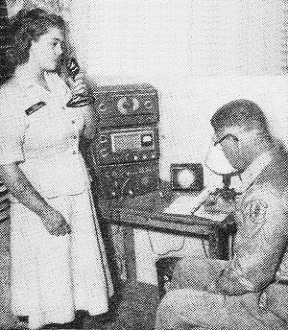 Cadet Carrie Hopkins of Albuquerque operates the radio while Lt. Col. Tom Hopkins makes a log entry - RF Cafe