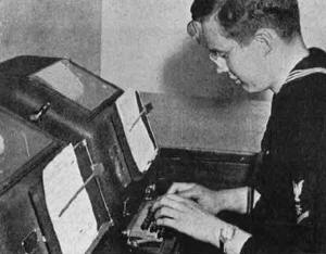A Navy radioman operates teletype equipment - RF Cafe