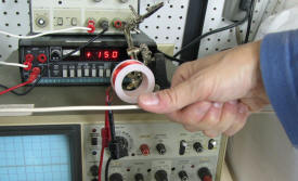 Right-Hand Rule for magnetic field around a current-carrying wire. RF Cafe lab photo. - RF Cafe