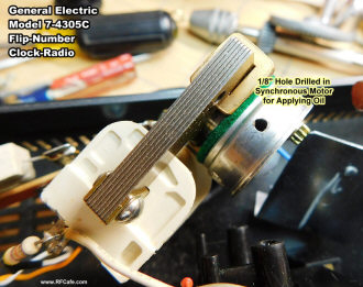 Hole drilled for oiling in GE model 7-4305C clock radio synchronous AC motor - RF Cafe