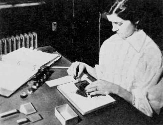 Tiny computer memory cores are counted with a paddle containing 400 holes - RF Cafe