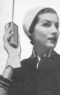 Lady is shown demonstrating one-way radio paging - RF Cafe