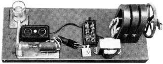 Hand generator mounted on plank - RF Cafe