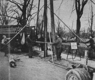 Linemen steady new pole with long, steel-pointed pikes - RF Cafe